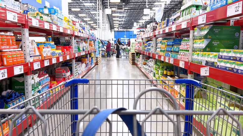 View of Sam's Club aisle from a shopping cart