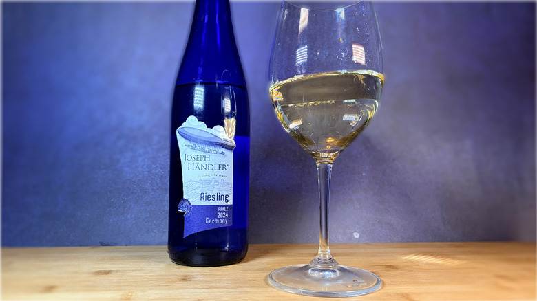 A bottle and glass of riesling white wine