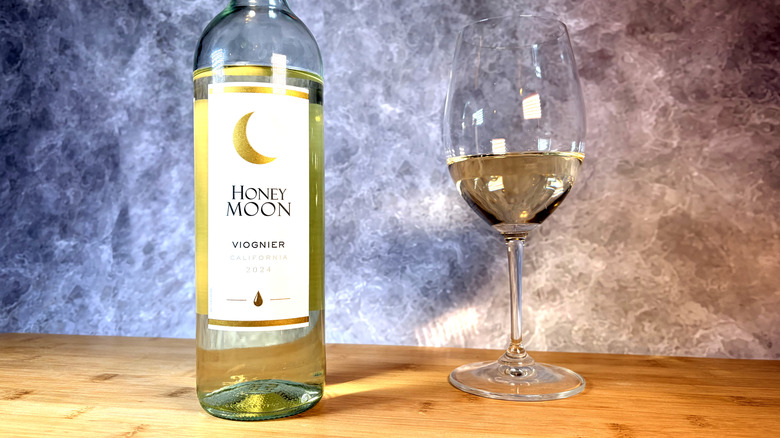 A bottle and glass of viognier white wine