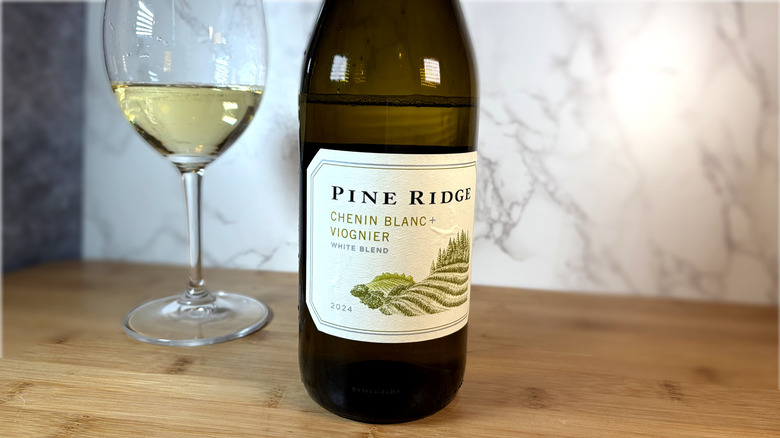 A bottle and glass of pine ridge white wine