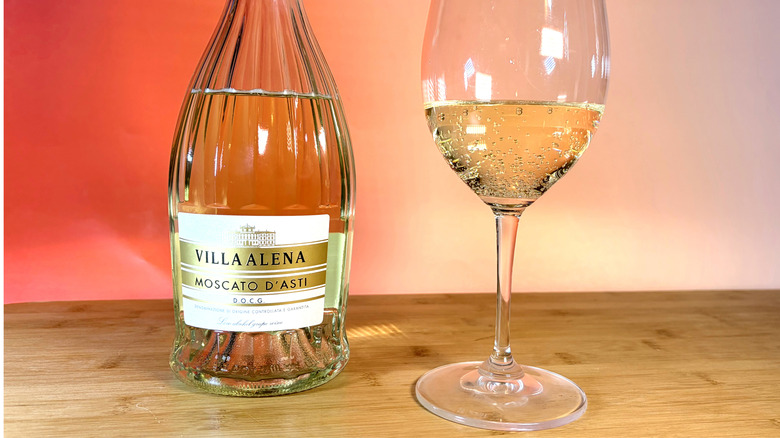 A bottle and glass of moscato wine