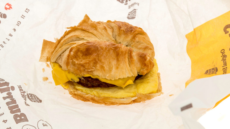 Burger King sausage breakfast sandwich on branded paper