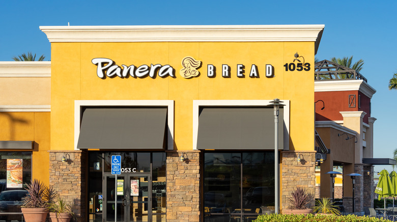 A Panera Bread sign on a building facade