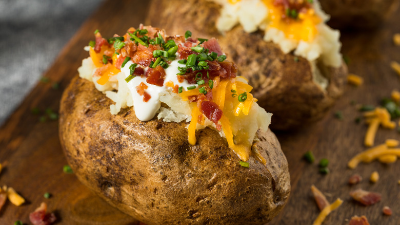 Loaded baked potato with cheese, chives, and bacon