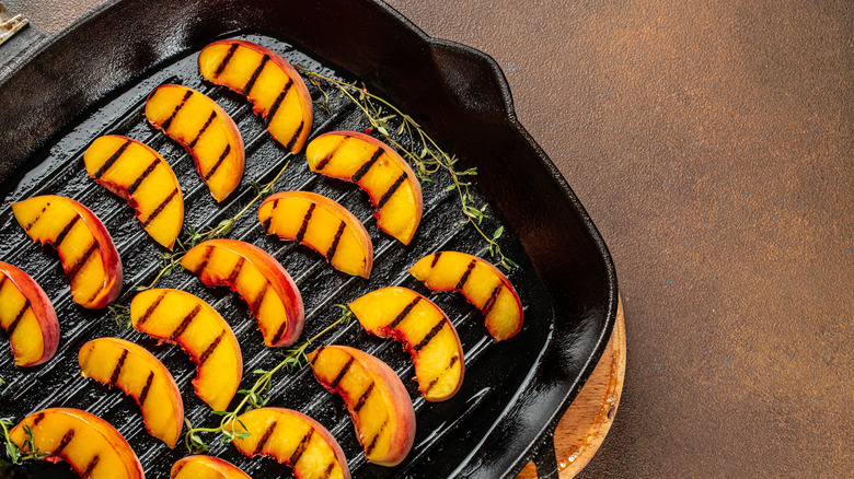 Peach slices on a grill
