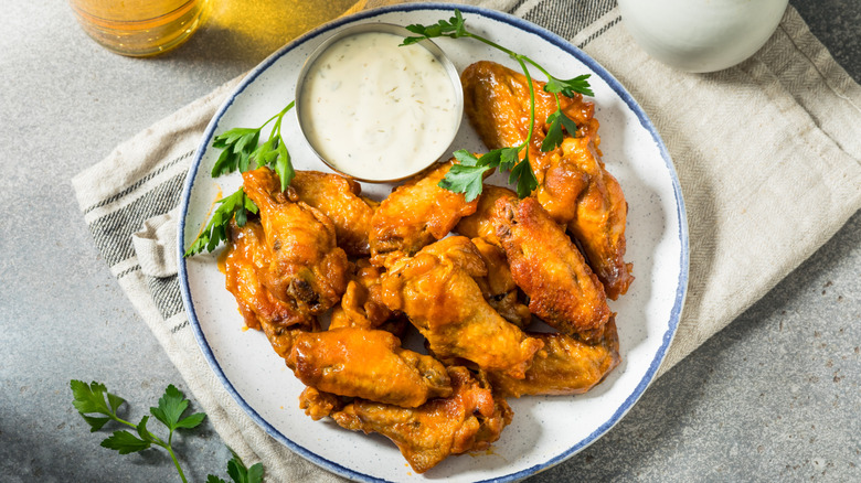 Ranch dressing and chicken wings on a plate