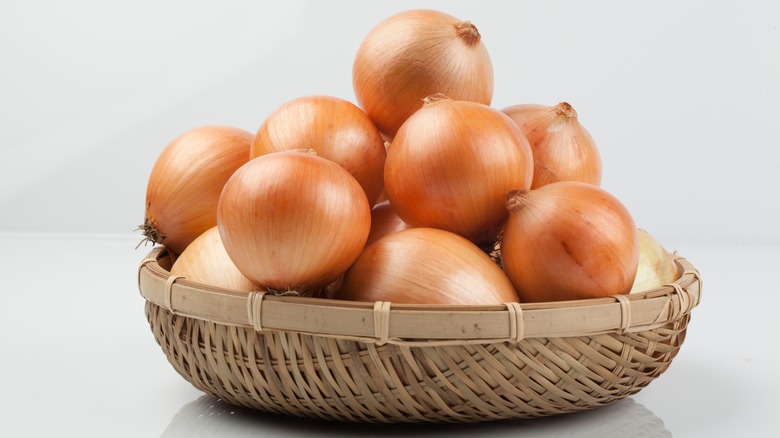 Onions in wicker bowl