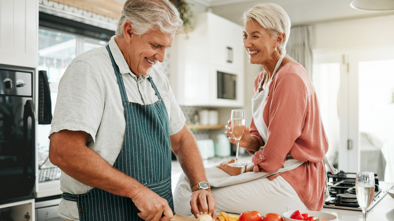 Happy senior couple in the kitchen together
