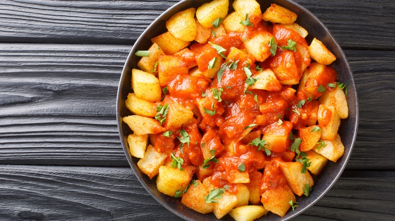 Patatas bravas in a bowl