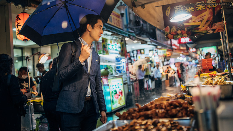 man at a street food stall in Taiwan
