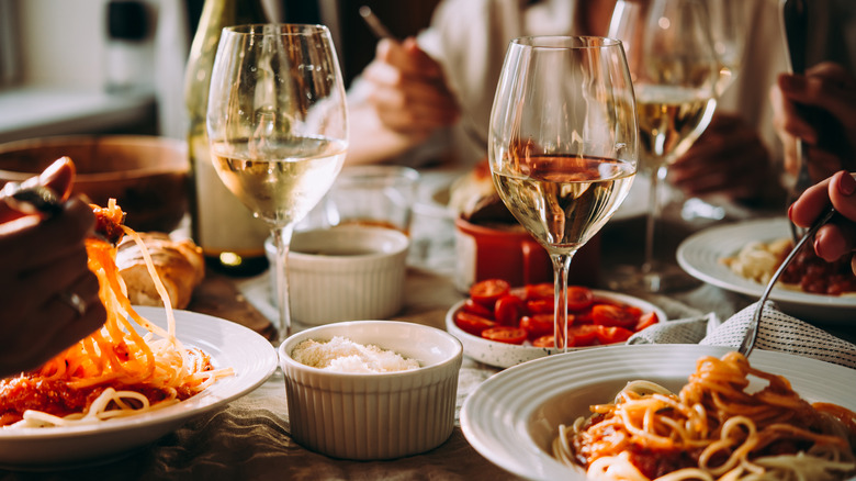 wine and pasta on dinner table