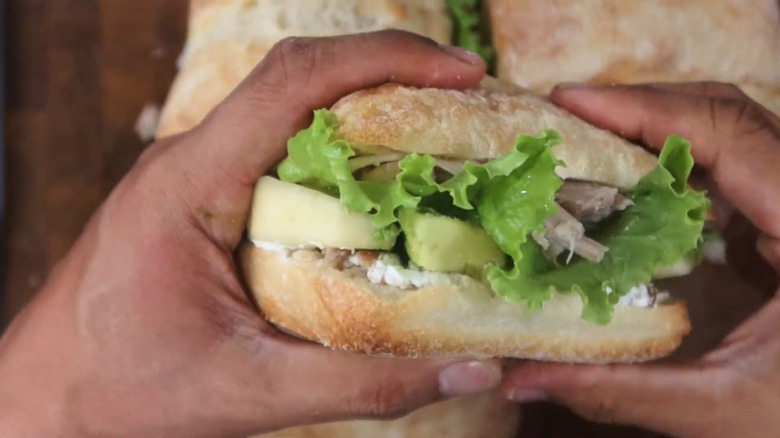 Hands holding a recreation of Britney Spears' homemade sandwich