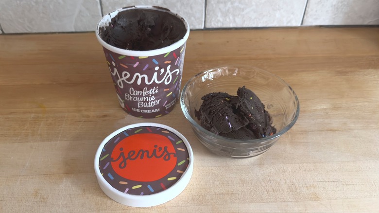 Open container and bowl of Jeni's Confetti Brownie Batter ice cream