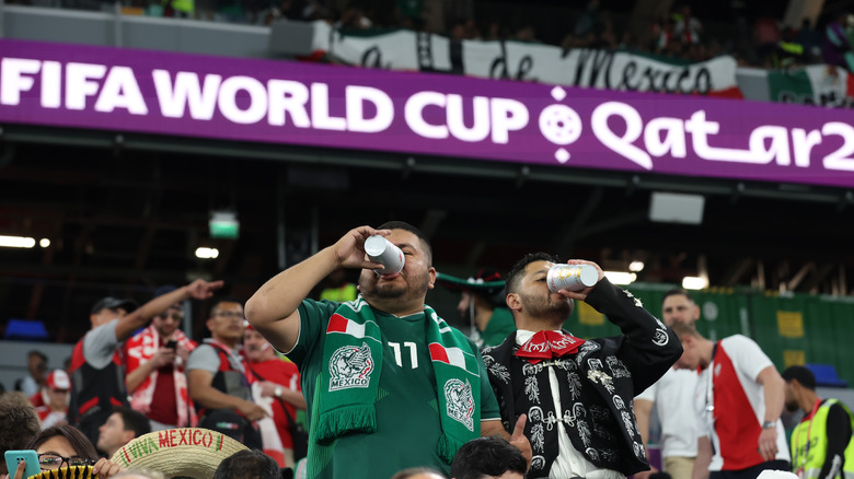 soccer fans drink beer during the world cup