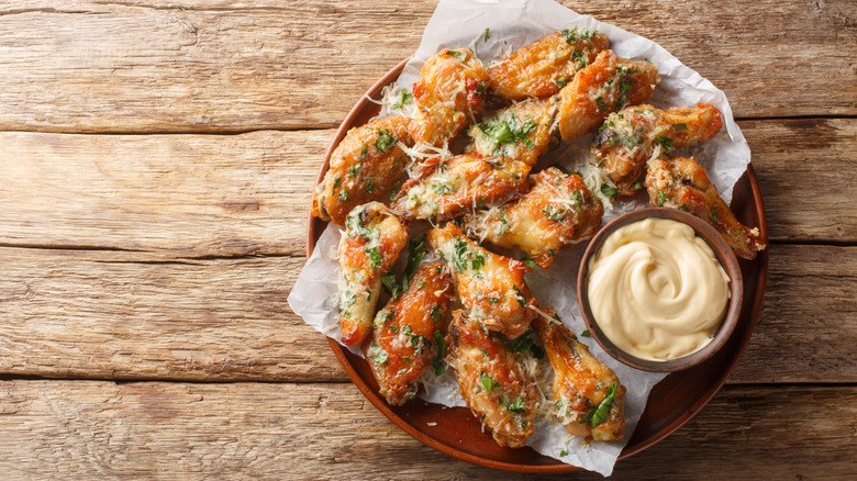 Garlic and Parmesan chicken wings with a creamy dip