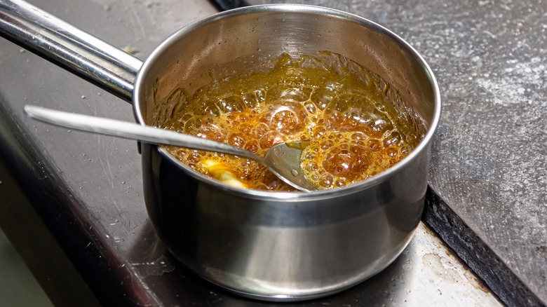 sugar caramelizing in metal pot