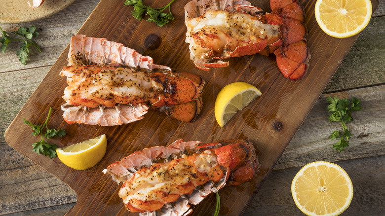 lobster tails on cutting board