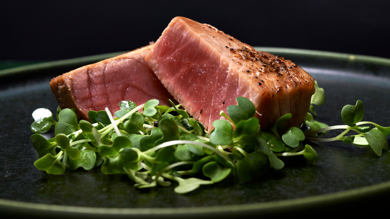 Tuna steaks on white background