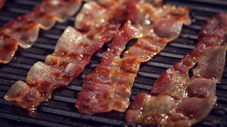 strips of bacon on grill