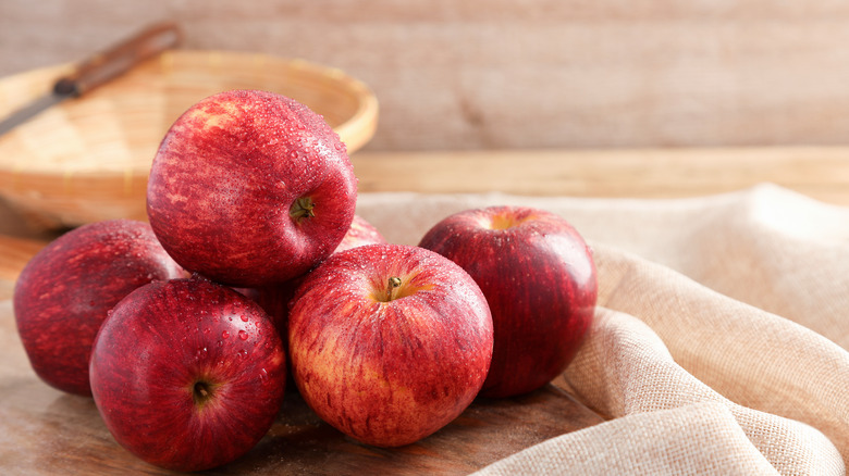 Pile of apples on wooden table