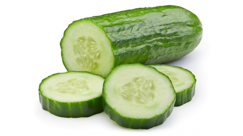 Sliced cucumber on white background