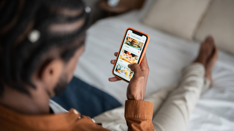 Man ordering dessert on phone