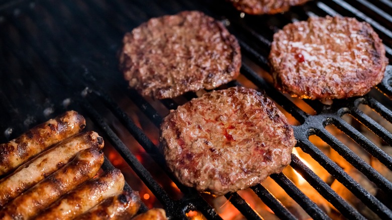 Sausage and burgers on grill