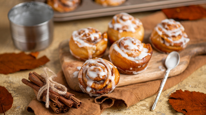 Five cinnamon rolls with icing