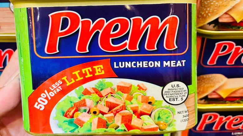 can of prem luncheon meat against grey background