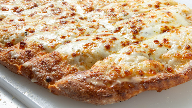 Cheesy garlic bread cut into strips