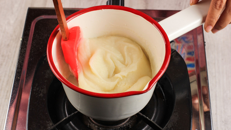Woman making mashed potatoes
