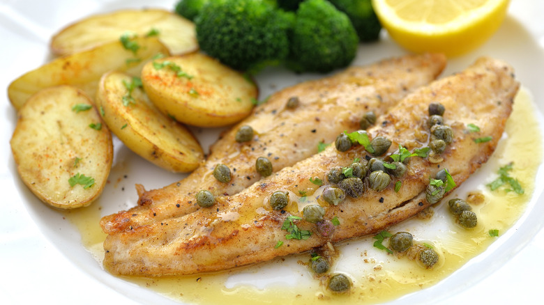 Dish of fish piccata with sides