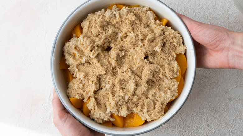 peach cobbler in baking dish 