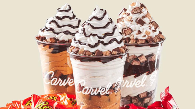 three carvel milkshakes on a gray background