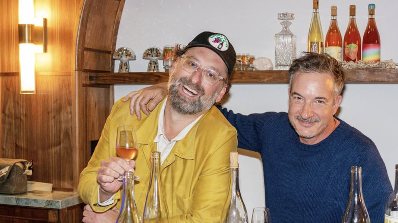 Eric Wareheim and Joel Burt behind a bar with bottles of Las Jaras wines