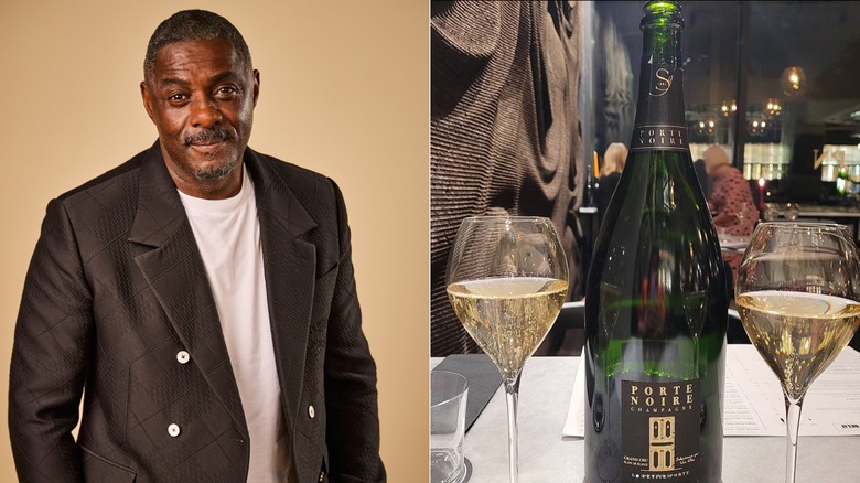 Actor Idris Elba and a bottle and glasses of his porte noire champagne on a restaurant table