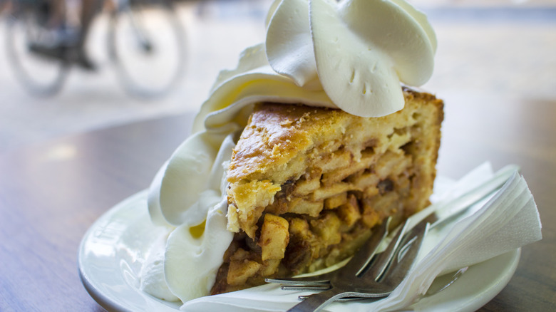 slice of apple pie with whipped cream