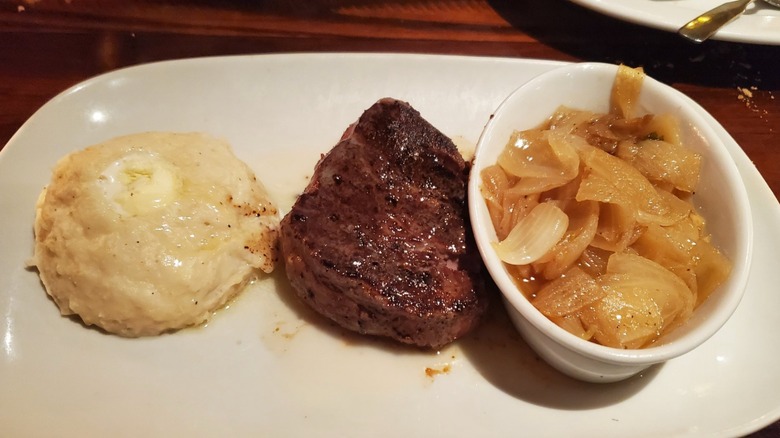 Filet mignon, grilled onion, and mashed potatoes served at LongHorn Steakhouse