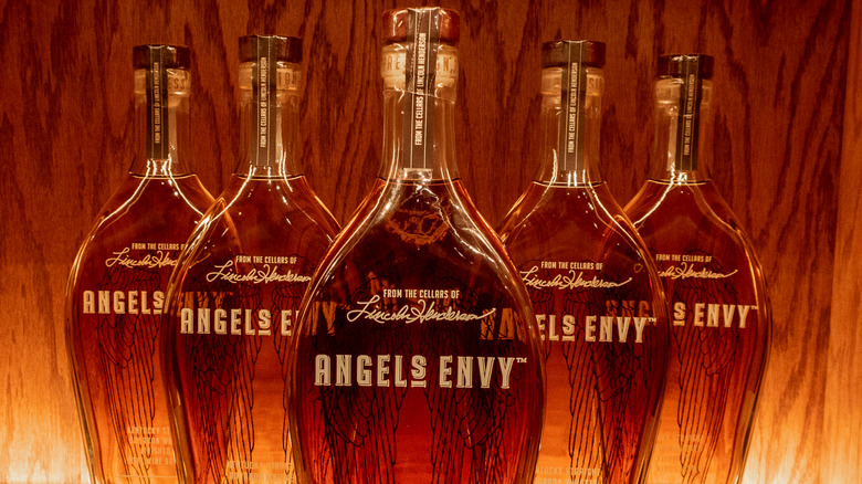 Angel's Envy bottles lined up on a shelf