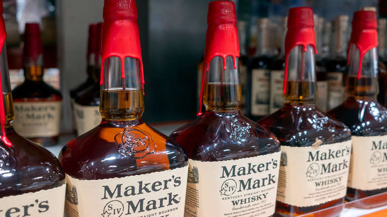 Maker's Mark bottles lined up on a shelf