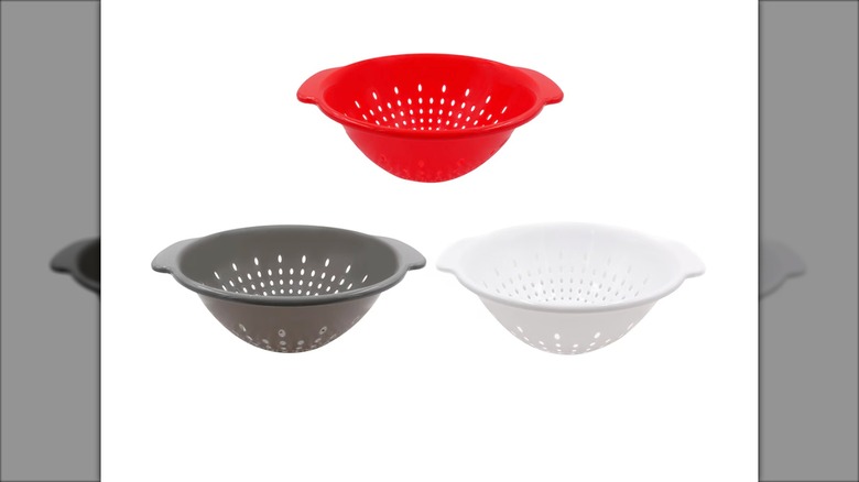 A red Dollar Tree Colander With Handle