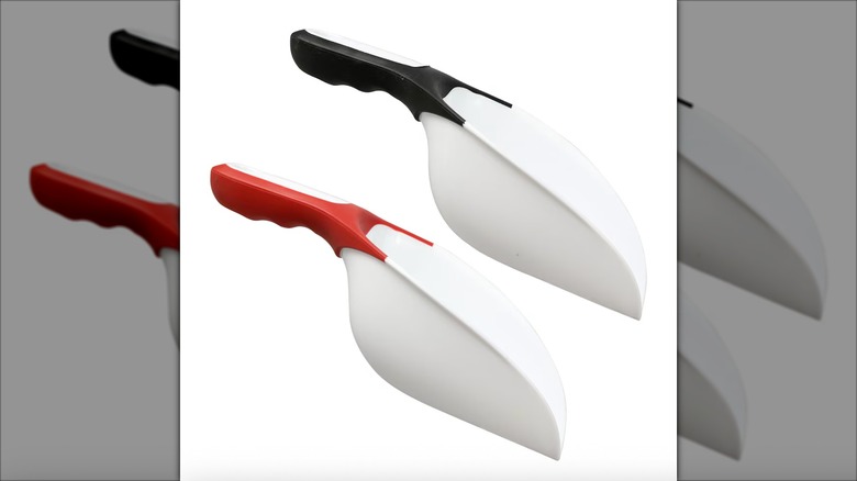 Two Cooking Concepts Scoops, one with a red grip and one with a black grip