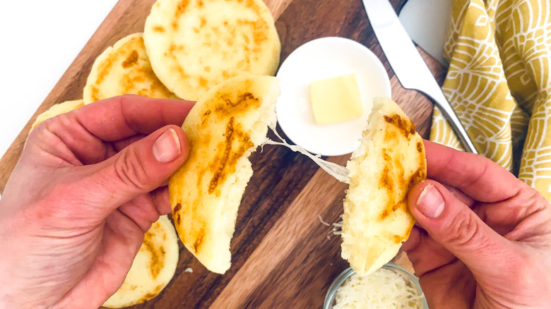cheese stuffed arepas on platter 