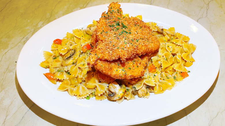 The Louisiana chicken pasta from The Cheesecake Factory with fried chicken piled high