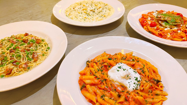 Four bowl of The Cheesecake Factory's pasta on a tabletop