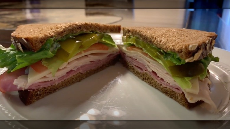 A large sandwich made with Cheesecake Factory brown bread