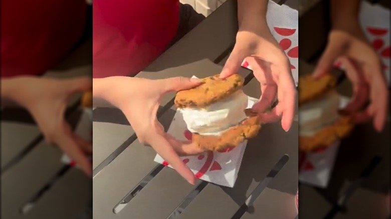 Ice cream sandwiches stacked on a board.