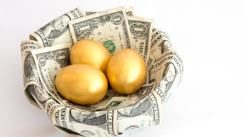 golden eggs with dollar bills