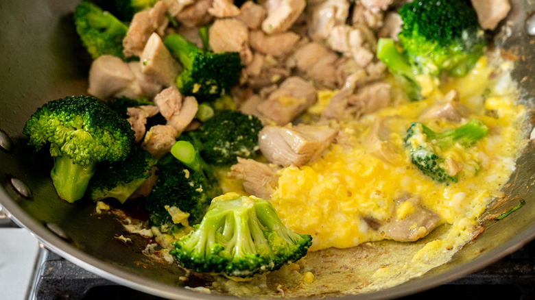 broccoli, chicken, eggs in wok