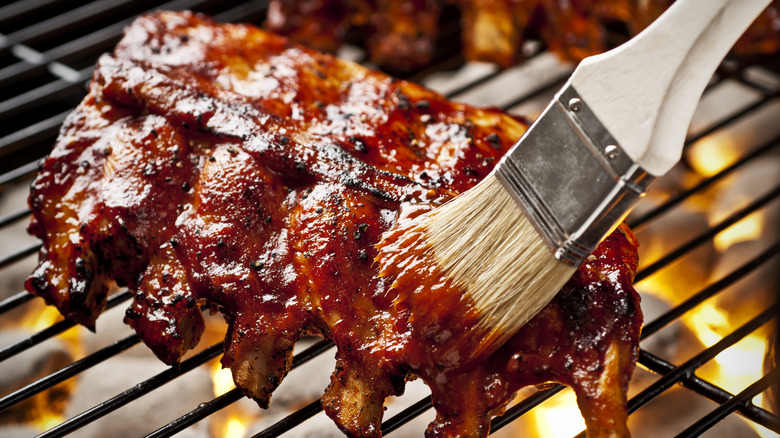 Ribs brushed with barbecue sauce